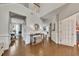 Spacious foyer with hardwood floors, wainscoting, and a view into other rooms at 213 Roseman Way, Woodstock, GA 30188