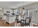 Eat-in kitchen with stainless appliances, granite countertops and lots of natural light at 213 Roseman Way, Woodstock, GA 30188