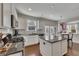 Bright white kitchen featuring stainless appliances, granite countertops, and an island at 213 Roseman Way, Woodstock, GA 30188