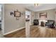 Welcoming living room features wood floors, comfortable seating, and decor at 213 Roseman Way, Woodstock, GA 30188