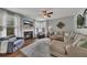 Comfortable living room with a fireplace, plush seating, and large windows at 213 Roseman Way, Woodstock, GA 30188