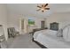 Large primary bedroom with vaulted ceilings and a seating area provides comfort and style at 213 Roseman Way, Woodstock, GA 30188