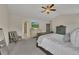 Comfortable main bedroom featuring vaulted ceilings, large windows, and neutral decor at 213 Roseman Way, Woodstock, GA 30188