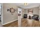 Finished basement sitting area features hardwood flooring, leather chairs, and sports memorabilia at 213 Roseman Way, Woodstock, GA 30188