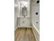 Stylish bathroom featuring a tub/shower, modern vanity, and wood-look floors at 350 White Birch Dr, Covington, GA 30016