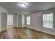 Cozy bedroom with modern flooring, neutral walls, natural light, and ample closet space at 350 White Birch Dr, Covington, GA 30016