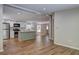 Open concept kitchen featuring stainless steel appliances, white cabinets, and a functional center island at 350 White Birch Dr, Covington, GA 30016