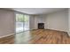 Living room featuring a cozy fireplace with marble accents and sliding glass door leading to outdoor deck at 350 White Birch Dr, Covington, GA 30016