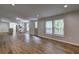 Spacious open-concept living and dining area with an eat-in kitchen and wood-look floors at 350 White Birch Dr, Covington, GA 30016