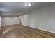 Spacious living room with wood-look floors, neutral walls, and recessed lighting at 350 White Birch Dr, Covington, GA 30016