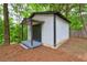 Outbuilding with covered entry, steps, and exterior clad with white siding at 350 White Birch Dr, Covington, GA 30016