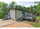 Exterior view of home featuring an open deck and easy access to backyard at 350 White Birch Dr, Covington, GA 30016