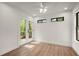 Bright bedroom featuring new floors, windows, and double doors to the outside at 3510 Holliglen Dr, Marietta, GA 30062