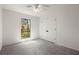 Bright bedroom with a window offering an outdoor view and a double door closet at 3510 Holliglen Dr, Marietta, GA 30062