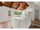 New kitchen features white cabinetry, quartz countertops, stainless steel appliances, and modern lighting at 3510 Holliglen Dr, Marietta, GA 30062