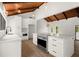 Kitchen with vinyl floors, an island, stainless steel appliances, and vaulted ceilings with custom lighting at 3510 Holliglen Dr, Marietta, GA 30062
