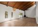 Open-concept living area featuring hardwood floors, a fireplace, vaulted ceilings and modern light fixtures at 3510 Holliglen Dr, Marietta, GA 30062