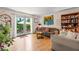 Inviting living room with hardwood floors, a cozy sofa, and views of the private backyard at 1261 Lavista Ne Rd # J-4, Atlanta, GA 30324