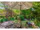 Landscaped patio with an umbrella covered table and chairs at 1261 Lavista Ne Rd # J-4, Atlanta, GA 30324