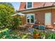 Patio area with seating, an umbrella, and beautiful landscaping at 1261 Lavista Ne Rd # J-4, Atlanta, GA 30324