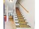 Carpeted staircase leading upstairs, showcasing the home's traditional design at 1261 Lavista Ne Rd # J-4, Atlanta, GA 30324