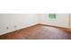 Empty bedroom with neutral walls and flooring, showing electrical outlets and a window at 2962 Invermere Woods Ct, Lithonia, GA 30038