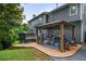 Beautiful backyard with a covered patio, lush lawn, and well-maintained landscaping at 4350 Oakdale Vinings Se Cir, Smyrna, GA 30080
