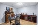 This finished basement features tile floor, a bar with wine storage and two chairs at 4350 Oakdale Vinings Se Cir, Smyrna, GA 30080