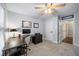 This bedroom features soft carpet, a ceiling fan, desk and view into hall with 'Gators' signage at 4350 Oakdale Vinings Se Cir, Smyrna, GA 30080
