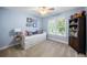 Light blue bedroom with a white daybed, a bookcase, and natural light from the window at 4350 Oakdale Vinings Se Cir, Smyrna, GA 30080