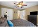 This bedroom features carpeted floors, ceiling fan and comfortable queen-sized bed at 4350 Oakdale Vinings Se Cir, Smyrna, GA 30080