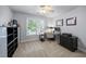 This bedroom features soft carpet, a ceiling fan, desk near window, and black shelving unit at 4350 Oakdale Vinings Se Cir, Smyrna, GA 30080