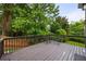 Spacious wooden deck with wooded views, offering a serene outdoor space at 4350 Oakdale Vinings Se Cir, Smyrna, GA 30080