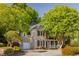 Beautiful brick home with a two-car garage, large trees and manicured landscaping at 4350 Oakdale Vinings Se Cir, Smyrna, GA 30080