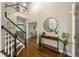 Grand foyer featuring hardwood floors, a staircase, and elegant decorative elements at 4350 Oakdale Vinings Se Cir, Smyrna, GA 30080