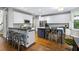 Modern kitchen featuring a center island, breakfast bar, stainless steel appliances, and white cabinets at 4350 Oakdale Vinings Se Cir, Smyrna, GA 30080