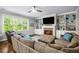 Comfortable living room with fireplace, built-ins, natural light and plush seating at 4350 Oakdale Vinings Se Cir, Smyrna, GA 30080