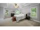 Spacious main bedroom with tray ceilings, neutral colors, large windows, and carpeted floors at 4350 Oakdale Vinings Se Cir, Smyrna, GA 30080