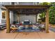 Cozy outdoor patio with pergola, seating area, and well-manicured landscaping at 4350 Oakdale Vinings Se Cir, Smyrna, GA 30080