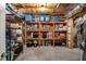Basement storage room with shelving units stocked with storage totes and boxes at 4350 Oakdale Vinings Se Cir, Smyrna, GA 30080