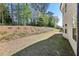 Large backyard featuring a blend of manicured lawn space and natural wooded beauty at 4775 Columbia St, Cumming, GA 30040