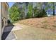 Spacious backyard with lush landscaping, and a private patio area perfect for entertaining at 4775 Columbia St, Cumming, GA 30040