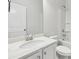 Well-lit bathroom with a sleek vanity and ample storage at 4775 Columbia St, Cumming, GA 30040