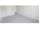 Cozy bedroom features neutral carpet and ample natural light from an adjacent doorway at 4775 Columbia St, Cumming, GA 30040