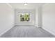 Cozy bedroom with a large window offering plenty of natural light at 4775 Columbia St, Cumming, GA 30040