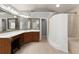 Bright bathroom featuring a walk-in shower and dual sink vanity at 975 Garden Crossing Ln, Cumming, GA 30040