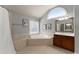 Bright bathroom featuring a soaking tub and large picture window at 975 Garden Crossing Ln, Cumming, GA 30040
