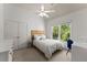 Bright bedroom featuring white linen bedding, and large windows at 975 Garden Crossing Ln, Cumming, GA 30040