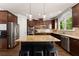 Well-equipped kitchen features stainless steel appliances, a center island, and ample storage at 975 Garden Crossing Ln, Cumming, GA 30040