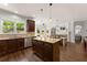 Spacious kitchen with a large center island, stainless appliances, and granite countertops at 975 Garden Crossing Ln, Cumming, GA 30040